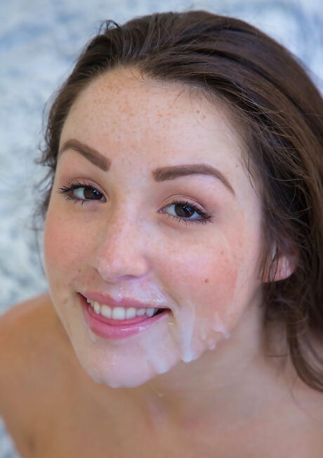 Shapely american teen Lola Foxx blowing huge black dick and takes a cum blast on her face 