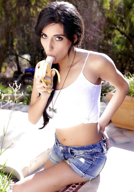 Very attractive bombshell Idelsy baring big tits and hairy pussy outside